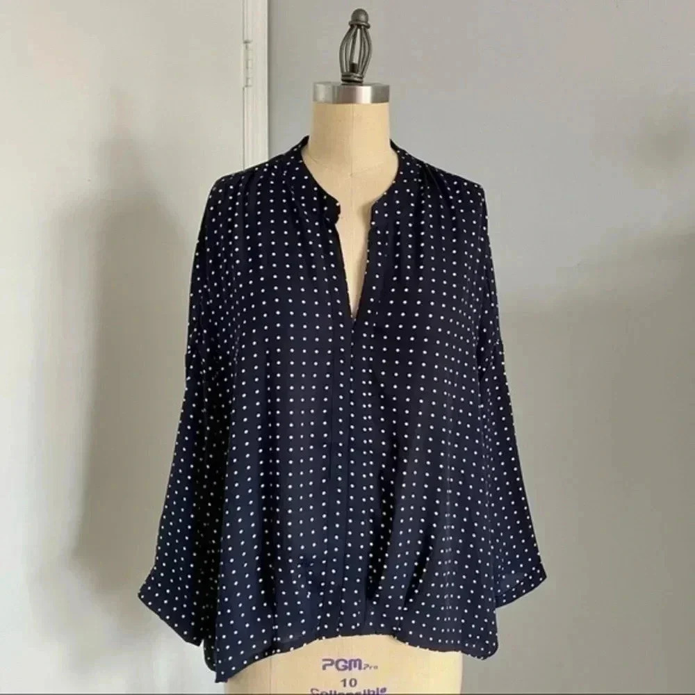 Navy polka dotted blouse​​